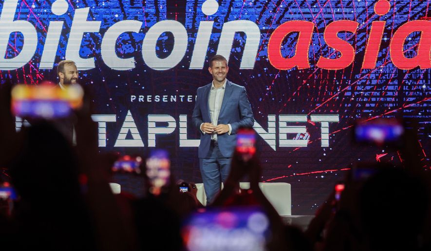 FILE - Eric Trump, Executive Vice President of the Trump Organization reacts during the Bitcoin Asia 2025, at the Hong Kong Exhibition Centre in Hong Kong, on Aug. 29, 2025. (AP Photo/Daniel Ceng, File)