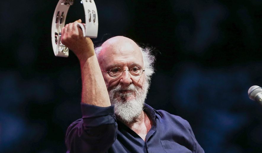 Greek singer-songwriter Dionysis Savvopoulos, performs at the Athens Concert Hall on Sept. 1, 2020. (InTime News via AP)