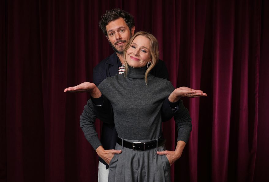 Adam Brody, left, and Kristen Bell, cast members in the Netflix series "Nobody Wants This," pose for a portrait in Los Angeles on Oct. 16, 2025. (AP Photo/Chris Pizzello)