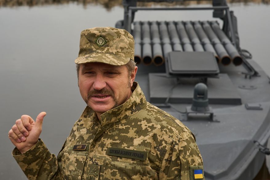 Ukraine's Security Service brigade general Ivan Lukashevych answers media questions in front of a Sea Baby drone during a demonstration at an undisclosed location in Ukraine Friday, Oct. 17, 2025. (AP Photo/Efrem Lukatsky)