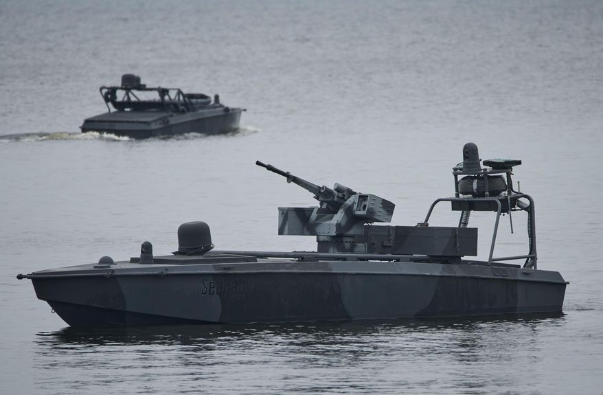 Sea Baby drones ride on the water during a demonstration by Ukraine's Security Service in an undisclosed location in Ukraine Friday, Oct. 17, 2025. (AP Photo/Efrem Lukatsky)
