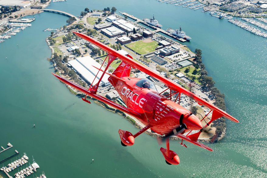 FILE - Team Oracle aerobatics pilot Sean D. Tucker flies over Coast Guard Island during a photo flight on Thursday, Oct. 5, 2017, in Oakland, Calif. (AP Photo/Noah Berger, File)