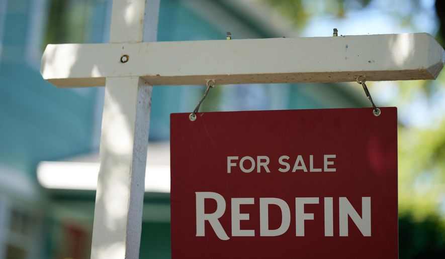 A "For Sale" sign is displayed outside a home on Friday, July 11, 2025, in Portland, Ore. (AP Photo/Jenny Kane, File)