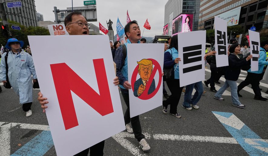 South Korean protesters march during a rally against U.S. President Donald Trump's tariffs policy on South Korea, in Seoul, South Korea, Oct. 18, 2025. The signs read "No Trump." (AP Photo/Ahn Young-joon) **FILE**