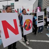 South Korean protesters march during a rally against U.S. President Donald Trump's tariffs policy on South Korea, in Seoul, South Korea, Oct. 18, 2025. The signs read "No Trump." (AP Photo/Ahn Young-joon) **FILE**