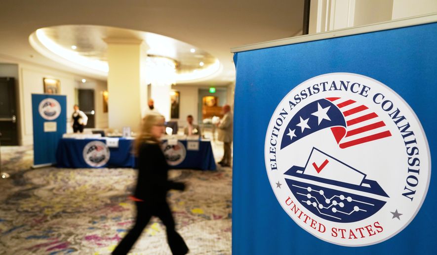 A person arrives for a U.S. Election Assistance Commission Standards Board public meeting, April 24, 2025, in Charlotte, N.C. (AP Photo/Chris Carlson, File)