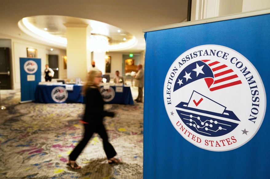 A person arrives for a U.S. Election Assistance Commission Standards Board public meeting, April 24, 2025, in Charlotte, N.C. (AP Photo/Chris Carlson, File)