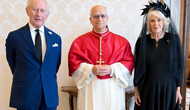 In this picture made available by Vatican Media, Britain's King Charles III and Queen Camilla pose with Pope Leo XIV as they meet at the Vatican during a state visit, Thursday, Oct. 23, 2025. (Vatican Media via AP, HO)