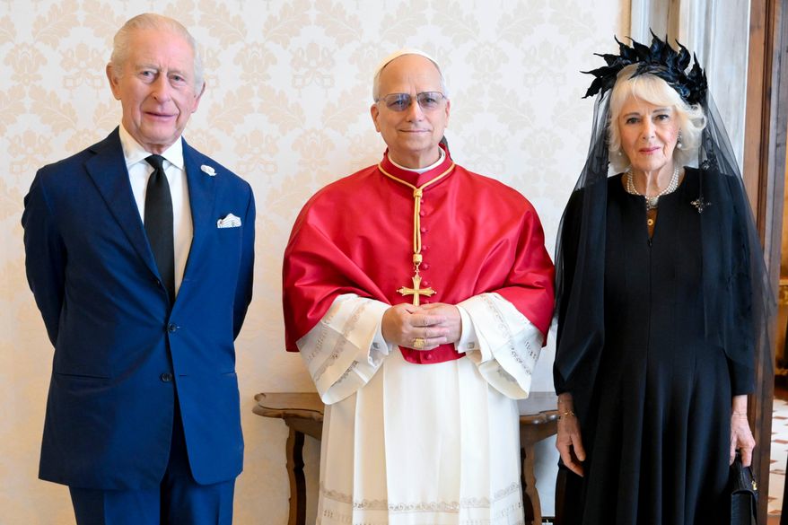 In this picture made available by Vatican Media, Britain's King Charles III and Queen Camilla pose with Pope Leo XIV as they meet at the Vatican during a state visit, Thursday, Oct. 23, 2025. (Vatican Media via AP, HO)