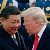In this Nov. 9, 2017, file photo, U.S. President Donald Trump, right, chats with Chinese President Xi Jinping during a welcome ceremony at the Great Hall of the People in Beijing. (AP Photo/Andy Wong, File)