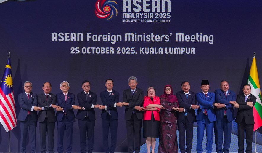 From left to right, Lao's Minister of Foreign Affairs Thongsavanh Phomvihane, Myanmar's Permanent Secretary of the Ministry of Foreign Affairs U Hau Khan Sum, Singapore's Permanent Secretary of Foreign Affairs Albert Chu, Thailand's Foreign Minister Sihasak Phuangketkeow, Vietnam's Deputy Minister of Foreign Affairs Dang Hoang Giang, Malaysia's Foreign Minister Mohamad Hasan, Philippine Foreign Secretary Theresa Lazaro, unidentified Brunei's representative, Cambodia's Foreign Minister Prak Sokhonn, Indonesia's Foreign Minister Sugiono, East Timor's Foreign Minister Bendito dos Santos Freitas and ASEAN Secretary-General Kao Kim Hourn pose for a group photo during ASEAN foreign ministers' meeting at the Kuala Lumpur Convention Centre in Kuala Lumpur, Malaysia, Saturday, Oct. 25, 2025. (AP Photo/Rafiq Maqbool)