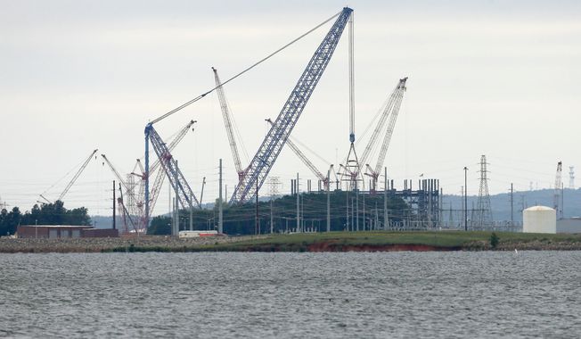 FILE - V.C. Summer Nuclear Station's unit two is shown under construction near Jenkinsville, S.C., during a media tour of the facility Wednesday, Sept. 21, 2016. (AP Photo/Chuck Burton)