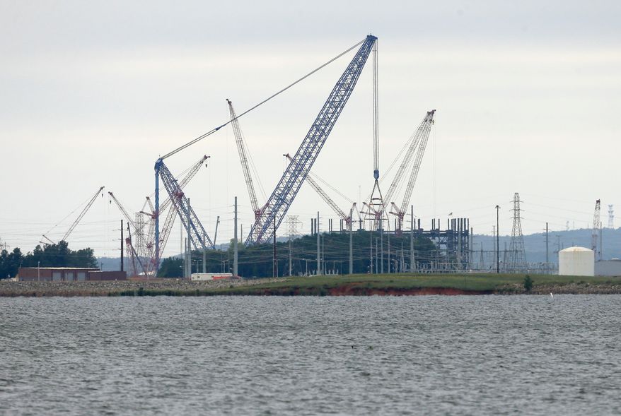 FILE - V.C. Summer Nuclear Station's unit two is shown under construction near Jenkinsville, S.C., during a media tour of the facility Wednesday, Sept. 21, 2016. (AP Photo/Chuck Burton)