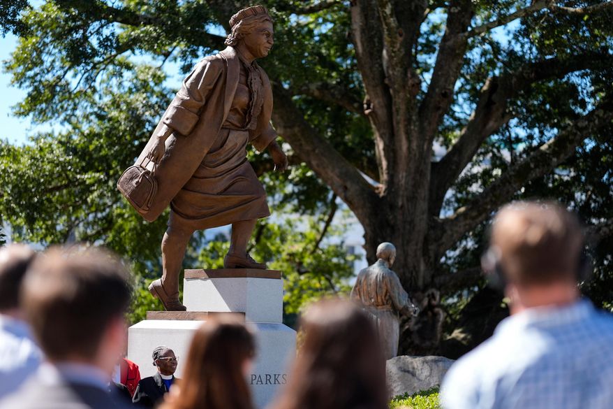 People view a newly unveiled statue of Rosa Parks on the grounds of the Alabama State Capitol, Friday, Oct. 24, 2025, in Montgomery, Ala. (AP Photo/Mike Stewart)