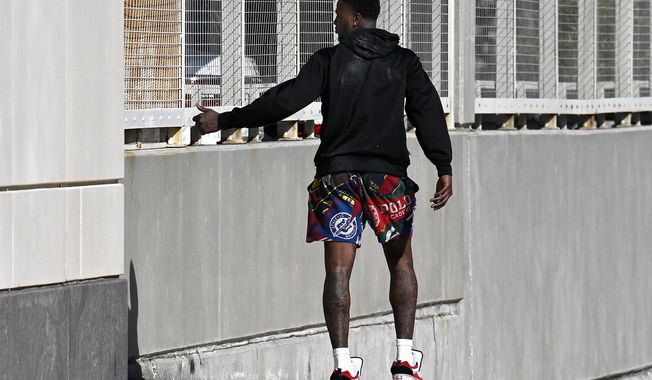 Miami Heat guard Terry Rozier leaves the U.S. Federal Courthouse through a side door after his arraignment, Thursday, Oct. 23, 2025, in Orlando, Fla. (AP Photo/Phelan M. Ebenhack)