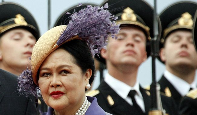 Queen Mother Sirikit passes by Russian honor guards while arriving in Moscow Vnukovo airport, July 2, 2007. (AP Photo/Misha Japaridze, File)