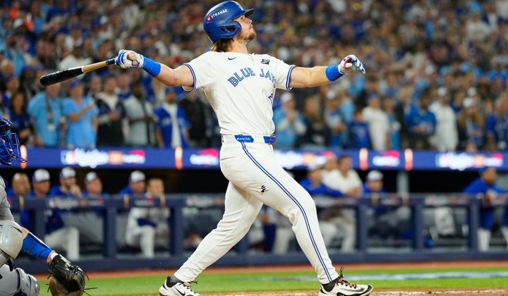 Toronto Blue Jays' Addison Barger watches his grand slam against the Los Angeles Dodgers during the sixth inning of Game 1 of baseball's World Series in Toronto, Friday, Oct. 24, 2025. (Frank Gunn/The Canadian Press via AP)