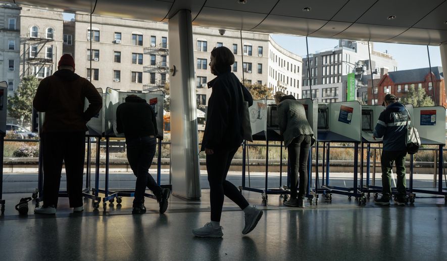 People cast their ballots during early voting on Saturday, Oct. 25, 2025, in New York. (AP Photo/Olga Fedorova)