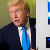 President Donald Trump speaks with reporters aboard Air Force One at Al Udeid Air Base in Doha, Qatar, Saturday, Oct. 25, 2025. (AP Photo/Mark Schiefelbein)