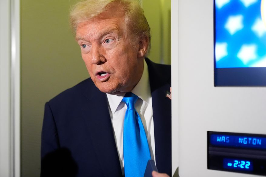 President Donald Trump speaks with reporters aboard Air Force One at Al Udeid Air Base in Doha, Qatar, Saturday, Oct. 25, 2025. (AP Photo/Mark Schiefelbein)