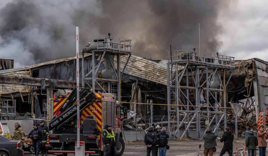 Smoke bellows from a warehouse that caught fire following a Russian attack, Saturday, Oct. 25, 2025, in Kyiv, Ukraine. (AP Photo/Julia Demaree Nikhinson)