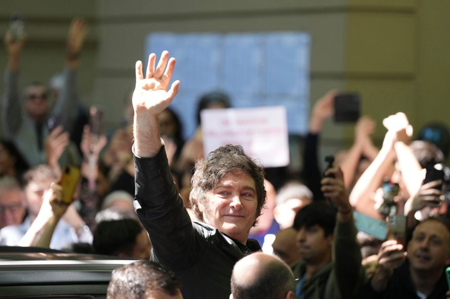 Argentina's President Javier Milei waves to supporters after voting during legislative midterm elections in Buenos Aires, Argentina, Sunday, Oct. 26, 2025. (AP Photo/Natacha Pisarenko)