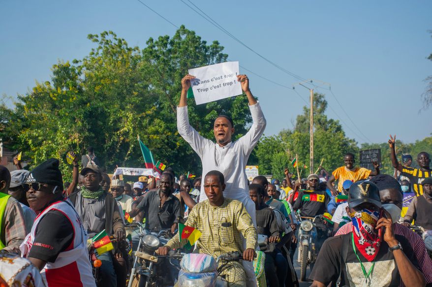 Supporters of opposition presidential candidate Issa Tchiroma, protest on the streets of Garoua, Cameroon, Sunday, Oct. 26, 2025. (AP Photo/Welba Yamo Pascal)