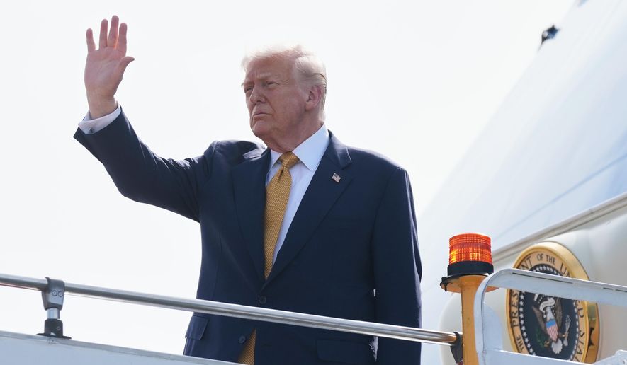 President Donald Trump waves as he boards Air Force One at Kuala Lumpur International Airport in Sepang, Malaysia, as he departs for Japan, Monday, Oct. 27, 2025. (AP Photo/Mark Schiefelbein)