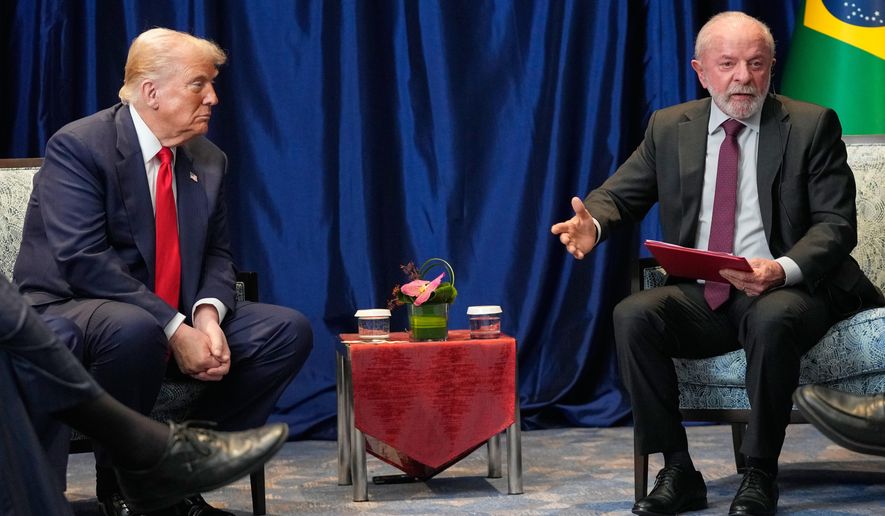 President Donald Trump meets with Brazil's President Luiz Inacio Lula da Silva on the sidelines of the ASEAN Summit in Kuala Lumpur, Malaysia, Sunday, Oct. 26, 2025. (AP Photo/Mark Schiefelbein)