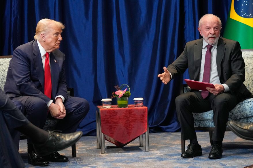 President Donald Trump meets with Brazil's President Luiz Inacio Lula da Silva on the sidelines of the ASEAN Summit in Kuala Lumpur, Malaysia, Sunday, Oct. 26, 2025. (AP Photo/Mark Schiefelbein)