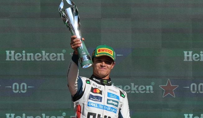 McLaren driver Lando Norris of Britain celebrates after winning the Formula One Mexico Grand Prix in Mexico City, Sunday, Oct. 26, 2025. (AP Photo/Fernando Llano)