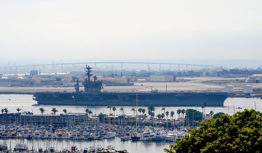 The USS Nimitz (CVN 68) departs San Diego Bay, Aug. 19, 2023, at Mission Beach, in San Diego. (Nelvin C. Cepeda/The San Diego Union-Tribune via AP, File)