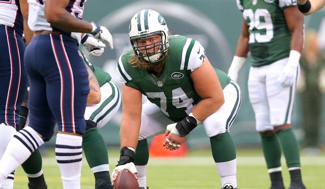 FILE - New York Jets center Nick Mangold (74) lines up against the New England Patriots during an NFL game at MetLife Stadium in East Rutherford, N.J. on Sunday, Dec. 27, 2015. (AP Photo/Brad Penner, File)