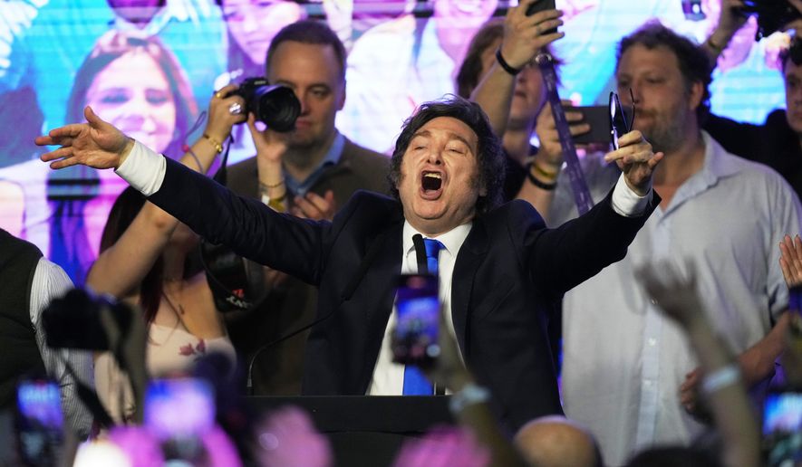 Argentina's President Javier Milei celebrates after winning in legislative midterm elections in Buenos Aires, Argentina, Sunday, Oct. 26, 2025. (AP Photo/Rodrigo Abd)