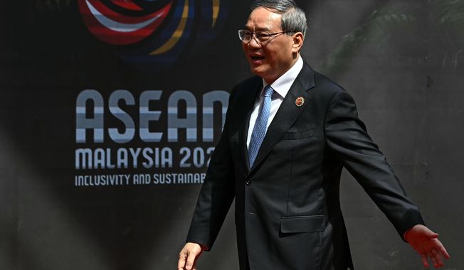 China's Premier Li Qiang arrives at the Kuala Lumpur Convention Centre to attend the 47th Association of Southeast Asian Nations (ASEAN) summit in Kuala Lumpur, Malaysia, Monday, Oct. 27, 2025. (Lillian Suwanrumpha/Pool Photo via AP)