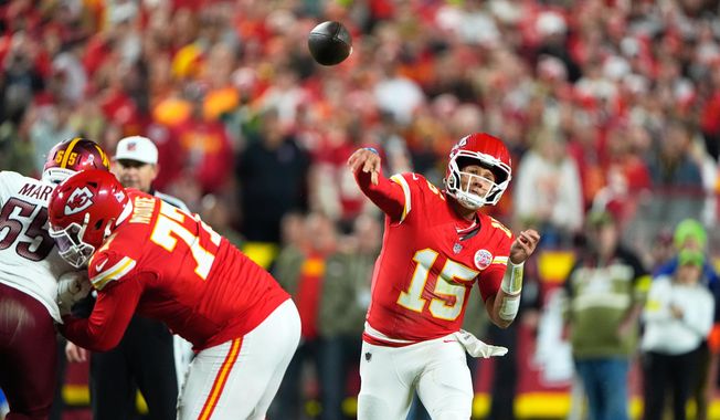 Kansas City Chiefs quarterback Patrick Mahomes (15) throws during the first half of an NFL football game against the Washington Commanders Monday, Oct. 27, 2025, in Kansas City, Mo. (AP Photo/Charlie Riedel)