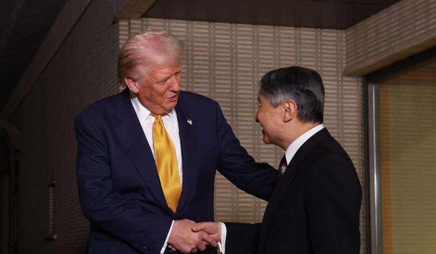President Donald Trump, left, and Japan's Emperor Naruhito shake hands during their meeting at the Imperial Palace in Tokyo, Oct. 27, 2025. (Issei Kato/Pool Photo via AP)