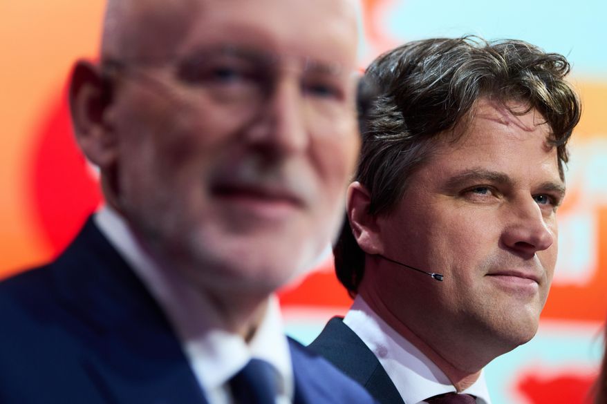 Frans Timmermans, of the center-left two-party bloc of Labor Party and Green Left, and Henri Bontenbal, party leader of the Christian Democratic Appeal, CDA, right, pose for a photo prior to a debate at the SBS6 TV studio in Hilversum, Netherlands, Thursday, Oct. 23, 2025. (AP Photo/Peter Dejong)