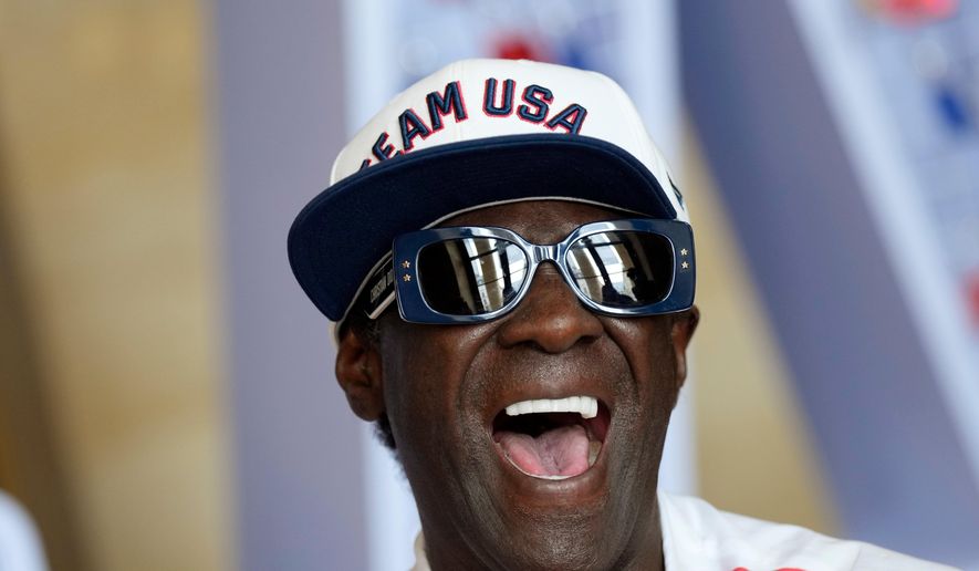 Flavor Flav laughs during an interview with The Associated Press at the USA house at the 2024 Summer Olympics, July 25, 2024, in Paris, France. (AP Photo/Luca Bruno, file)