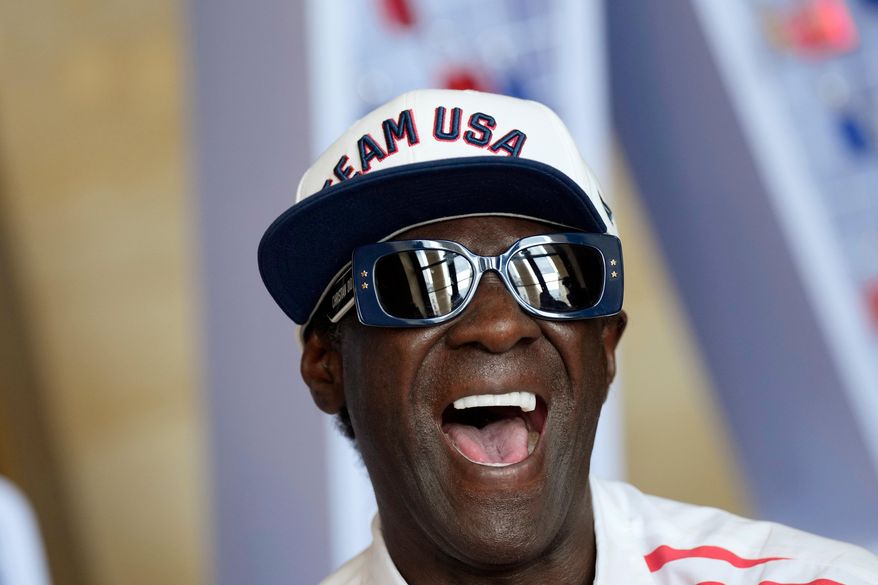 Flavor Flav laughs during an interview with The Associated Press at the USA house at the 2024 Summer Olympics, July 25, 2024, in Paris, France. (AP Photo/Luca Bruno, file)