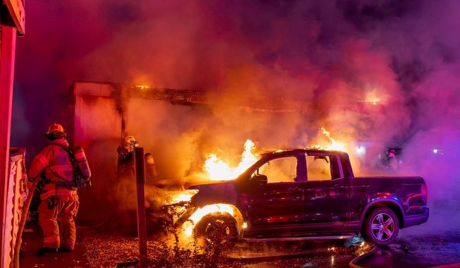 The cars and part of the home of Portland City Council member Candace Avalos were engulfed in a fire that Oregon police are investigating as an arson over the Oct. 25-26, 2025 weekend. (Photo courtesy Dennis Weis/Portland Fire & Rescue)