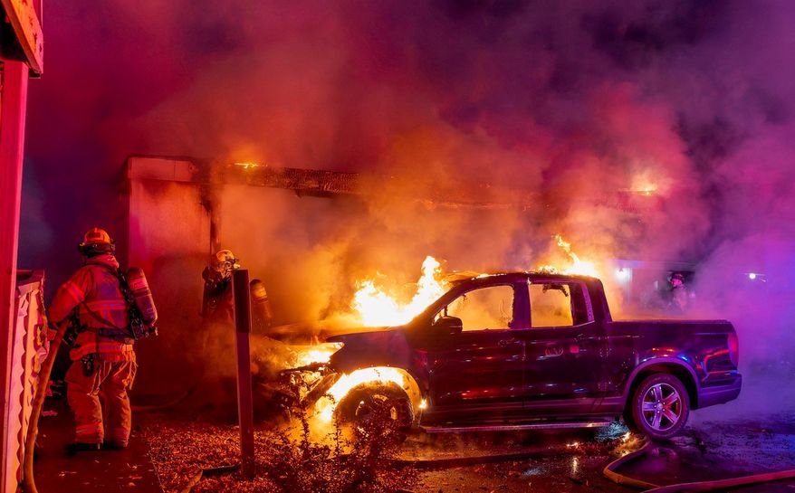The cars and part of the home of Portland City Council member Candace Avalos were engulfed in a fire that Oregon police are investigating as an arson over the Oct. 25-26, 2025 weekend. (Photo courtesy Dennis Weis/Portland Fire & Rescue)