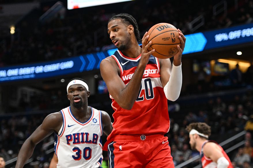 Washington Wizards center Alex Sarr (20) pulling down a rebound during the first quarter of an NBA game against the Philadelphia 76ers at Capital One Arena in Washington D.C., October 28, 2025. (Photo for the Washington Times)