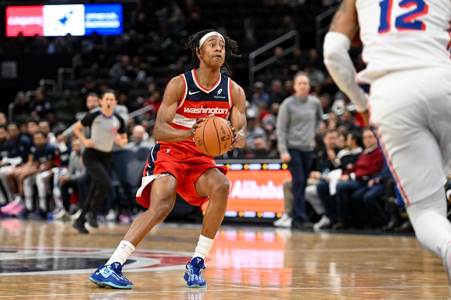 Washington Wizards guard Tre Johnson (12) lining up a shot during the fourth quarter of an NBA game against the Philadelphia 76ers at Capital One Arena in Washington D.C., October 28, 2025. (Photo for the Washington Times)