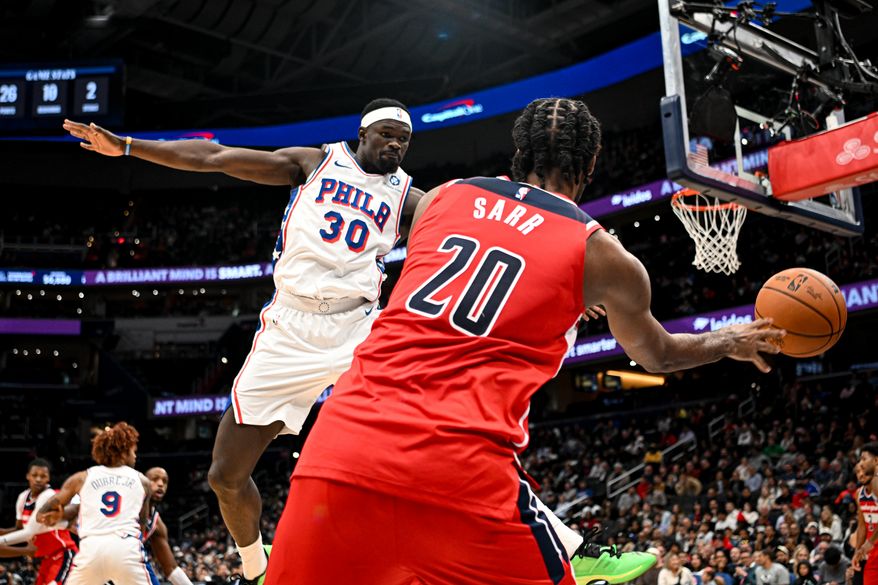 Washington Wizards center Alex Sarr (20) inbouding the ball as Philadelphia 76ers forward Adem Bona (30) defends during the fourth quarter of an NBA game at Capital One Arena in Washington D.C., October 28, 2025. (Photo for the Washington Times)