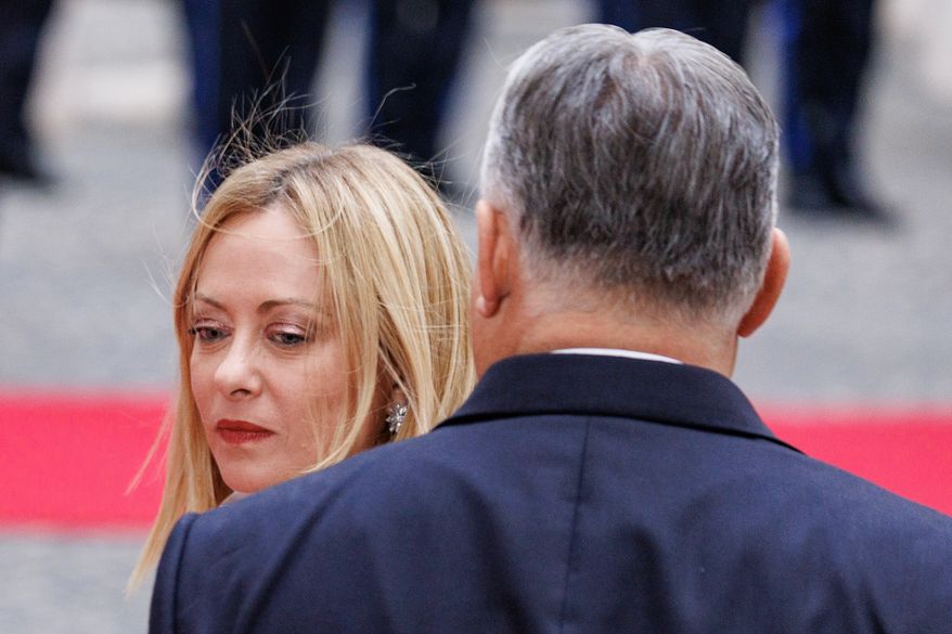 Italian Premier Giorgia Meloni, left, receives Hungary's Prime Minister Viktor Orbán in Rome, Monday, Oct. 27, 2025. (Roberto Monaldo/LaPresse via AP)