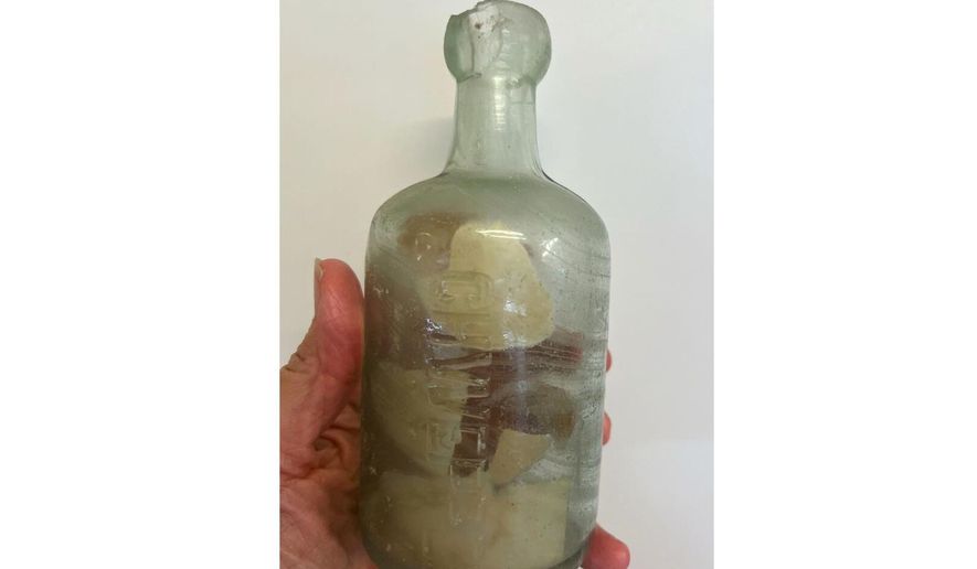 This photo provided by Deb Brown shows a bottle with letters inside in Condingup, Australia, Saturday, Oct. 25, 2025. (Deb Brown via AP)