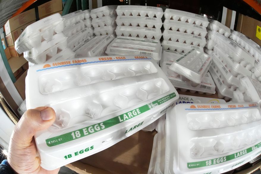A shopper selects a carton of 18 Large Grade A eggs from a cooler in a Costco Warehouse in Cranberry, Pa., on Jan. 28, 2025. (AP Photo/Gene J. Puskar) **FILE**