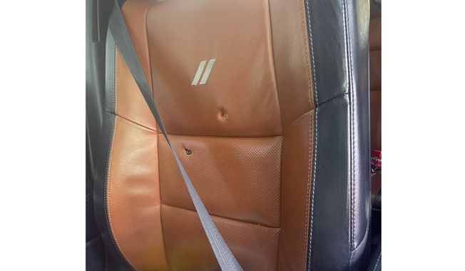 This image provided by Elizabeth Paige White shows bullet holes in a seat in a vehicle of Phillip M. Brown after a Homeland Security Investigations agent fired shots Oct. 17, 2025, in Washington, during a traffic stop. (Elizabeth Paige White via AP)