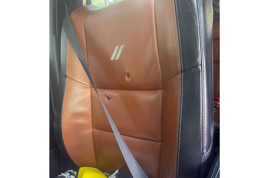 This image provided by Elizabeth Paige White shows bullet holes in a seat in a vehicle of Phillip M. Brown after a Homeland Security Investigations agent fired shots Oct. 17, 2025, in Washington, during a traffic stop. (Elizabeth Paige White via AP)